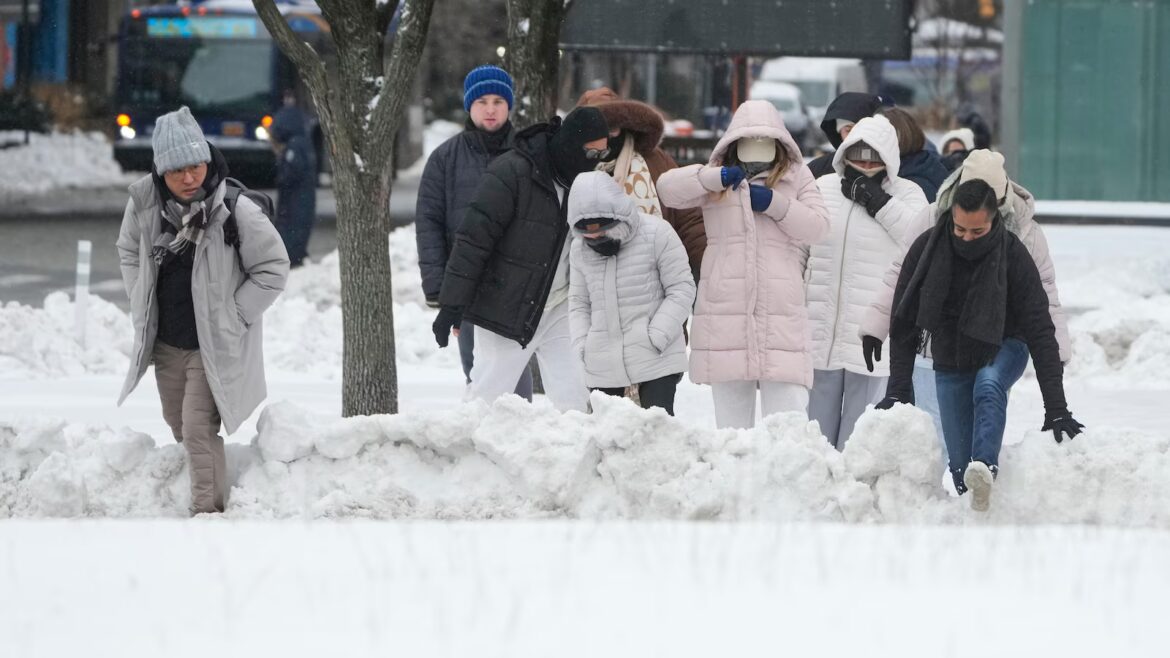 Blizzard warnings send East Coast scrambling to prepare for heavy snow and strong winds