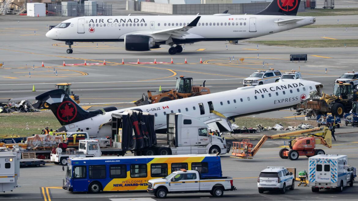Mangled plane in LaGuardia crash is towed from runway as most injured passengers leave hospital