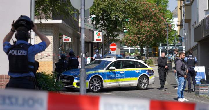 Suspect at large after hostage situation at bank in Germany, police say – National